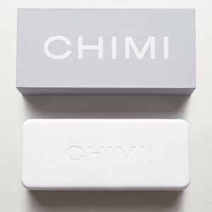 A handcrafted white box with the word Steel Aviator Green Lenses Sunglasses 56mm on it, by Chimi.