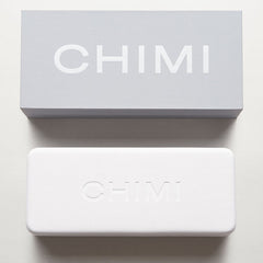 A handcrafted white box with the word Steel Aviator Green Lenses Sunglasses 56mm on it, by Chimi.