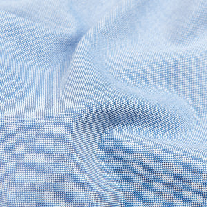 A close-up of a handmade Blue Classic Cotton Oxford BD Shirt by Drake's.