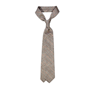 A Dreaming Of Monday Brown Checked 7-Fold Vintage Wool Tie in a brown and beige plaid pattern on a white background.