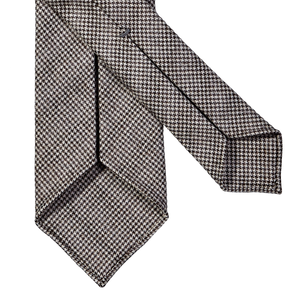 A Dreaming Of Monday Brown Houndstooth 7-Fold Vintage Wool Tie featuring a houndstooth pattern on a white background.