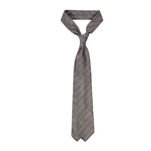 A Dreaming Of Monday Brown Houndstooth 7-Fold Vintage Wool Tie on a white background.