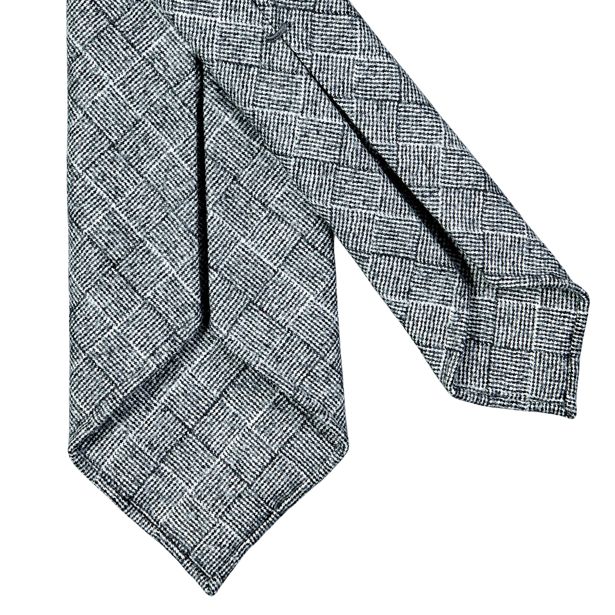 A grey checked 7-fold vintage wool tie on a white background, specifically the Dreaming of Monday wool tie.