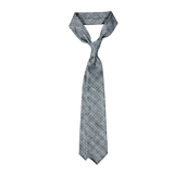 A Dreaming Of Monday grey checked 7-fold vintage wool tie on a white background.