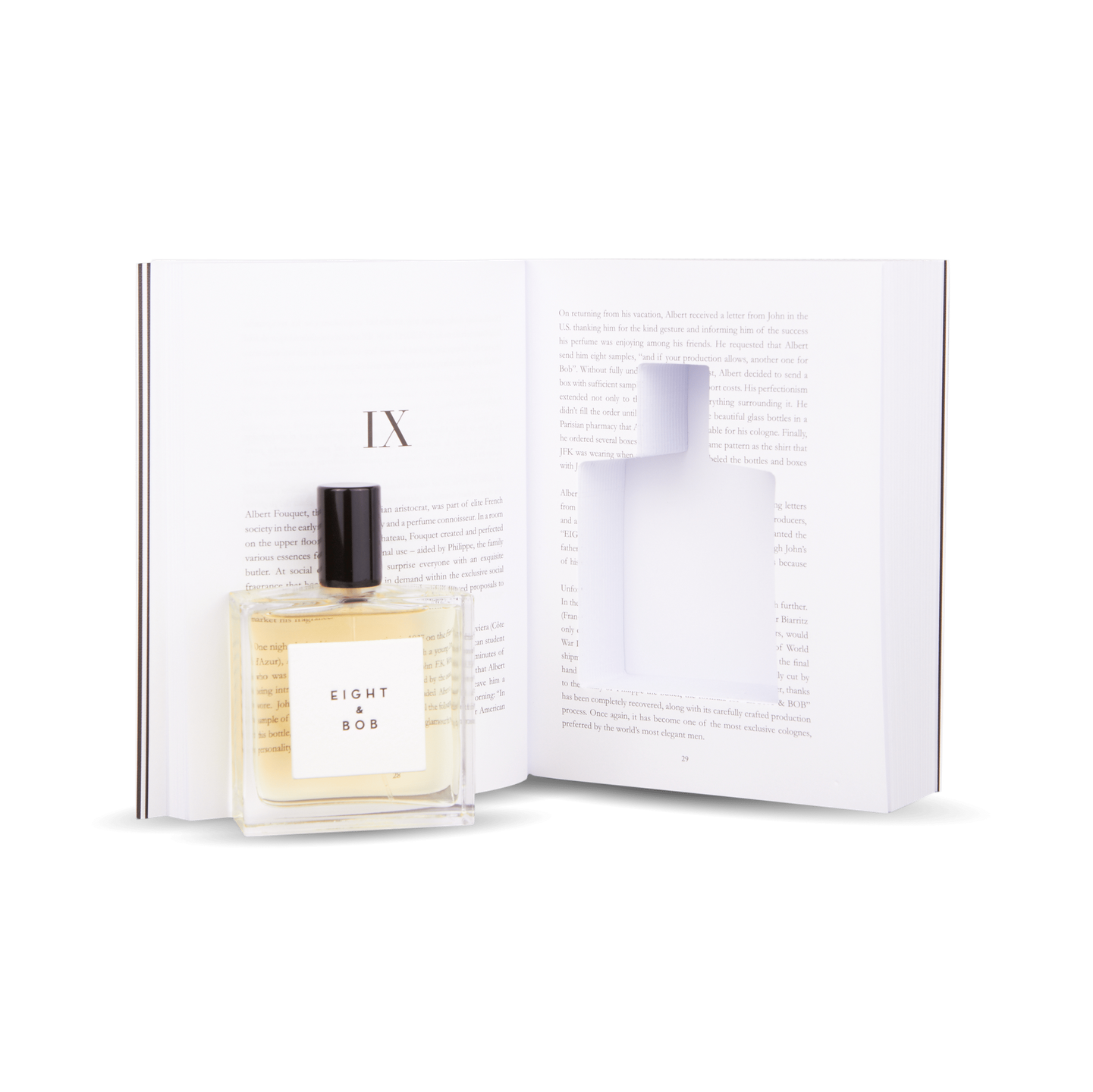 An Eight Bob Perfume Original 100 ml Inside Book rests on an open book.
