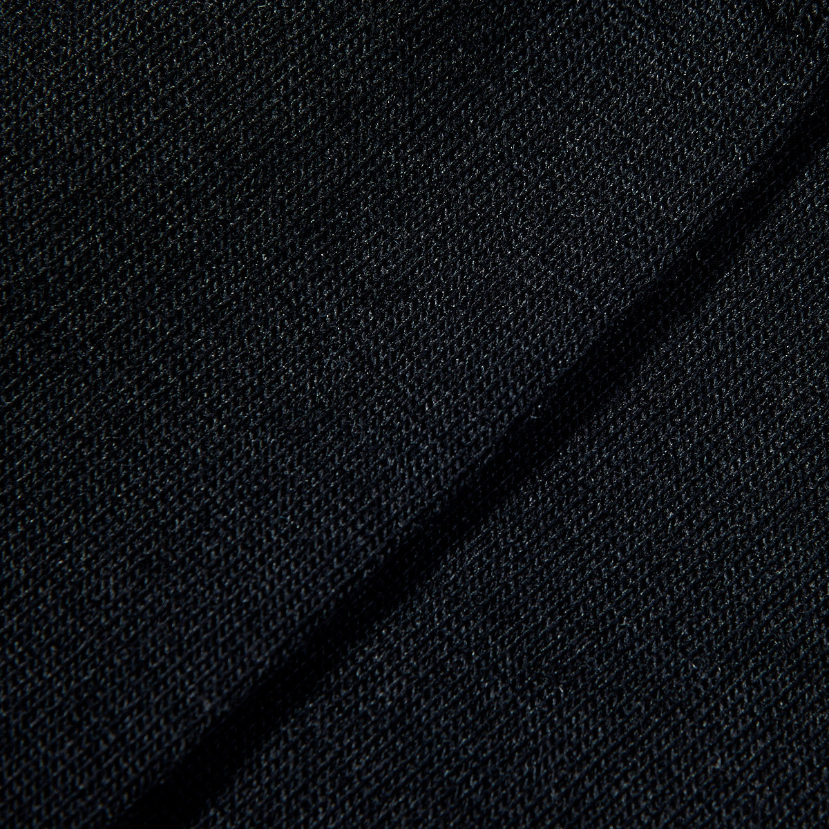 A close up image of a black Falke Airport Wool Cotton Socks sweater.