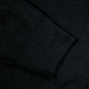 A close up of a Fedeli Black 140s Wool Mockneck Sweater.