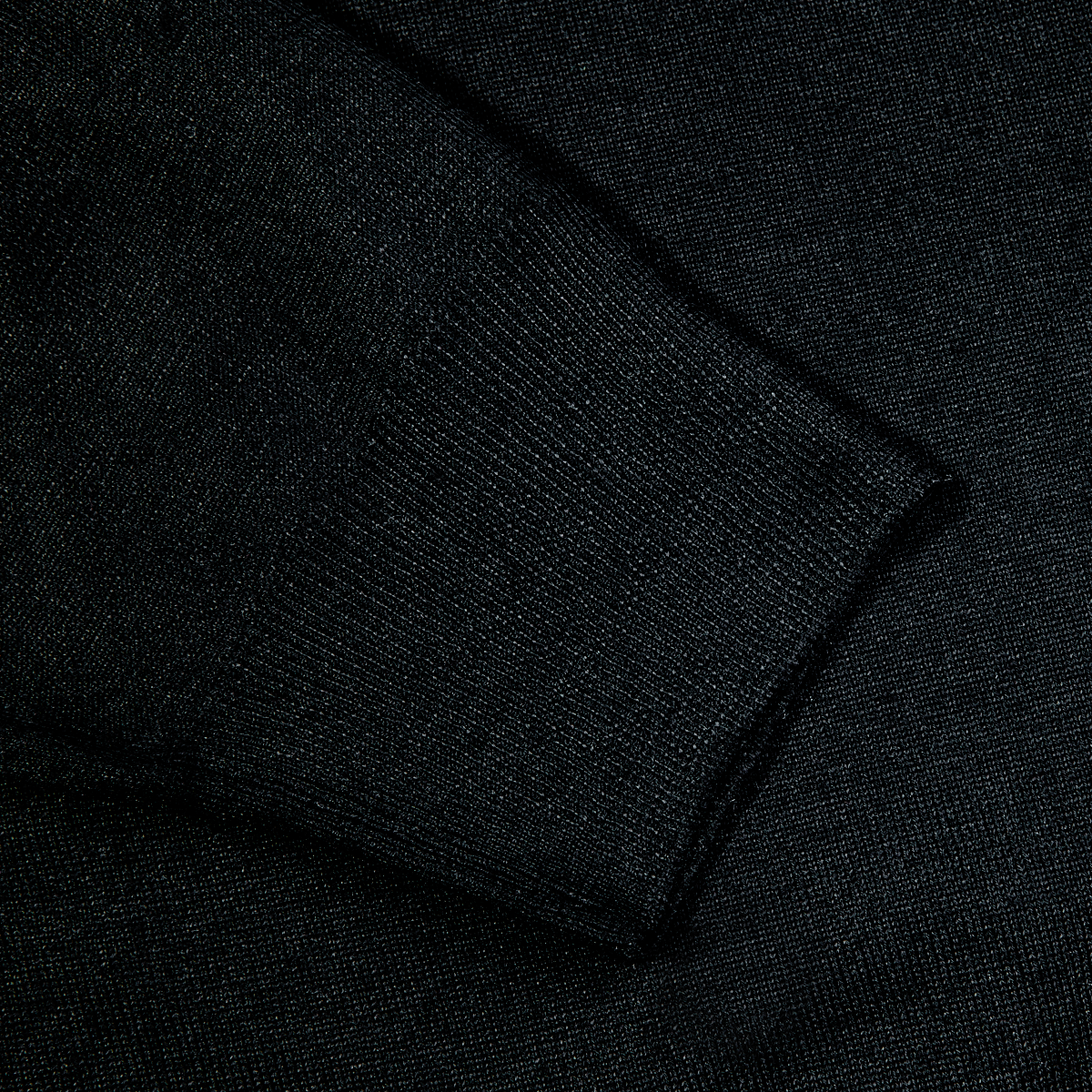 A close up of a Fedeli Black 140s Wool Mockneck Sweater.