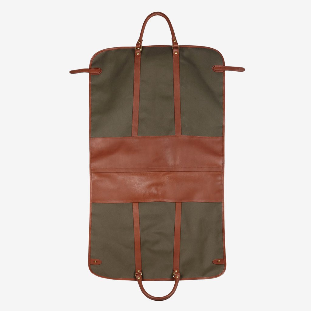 A Green Canvas Chestnut Leather garment bag by Frank Clegg for travel gear on a white background.