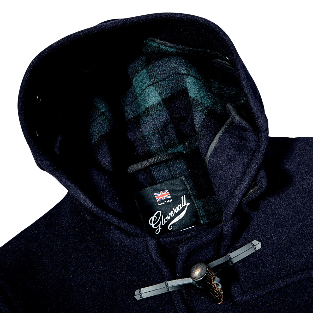 A Gloverall Navy Blue Wool Morris Duffle Coat with a plaid label on the hood, made of Italian wool.