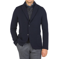 A man wearing a Navy Blue Rain Wool Knitted Jacket blazer by Gran Sasso.