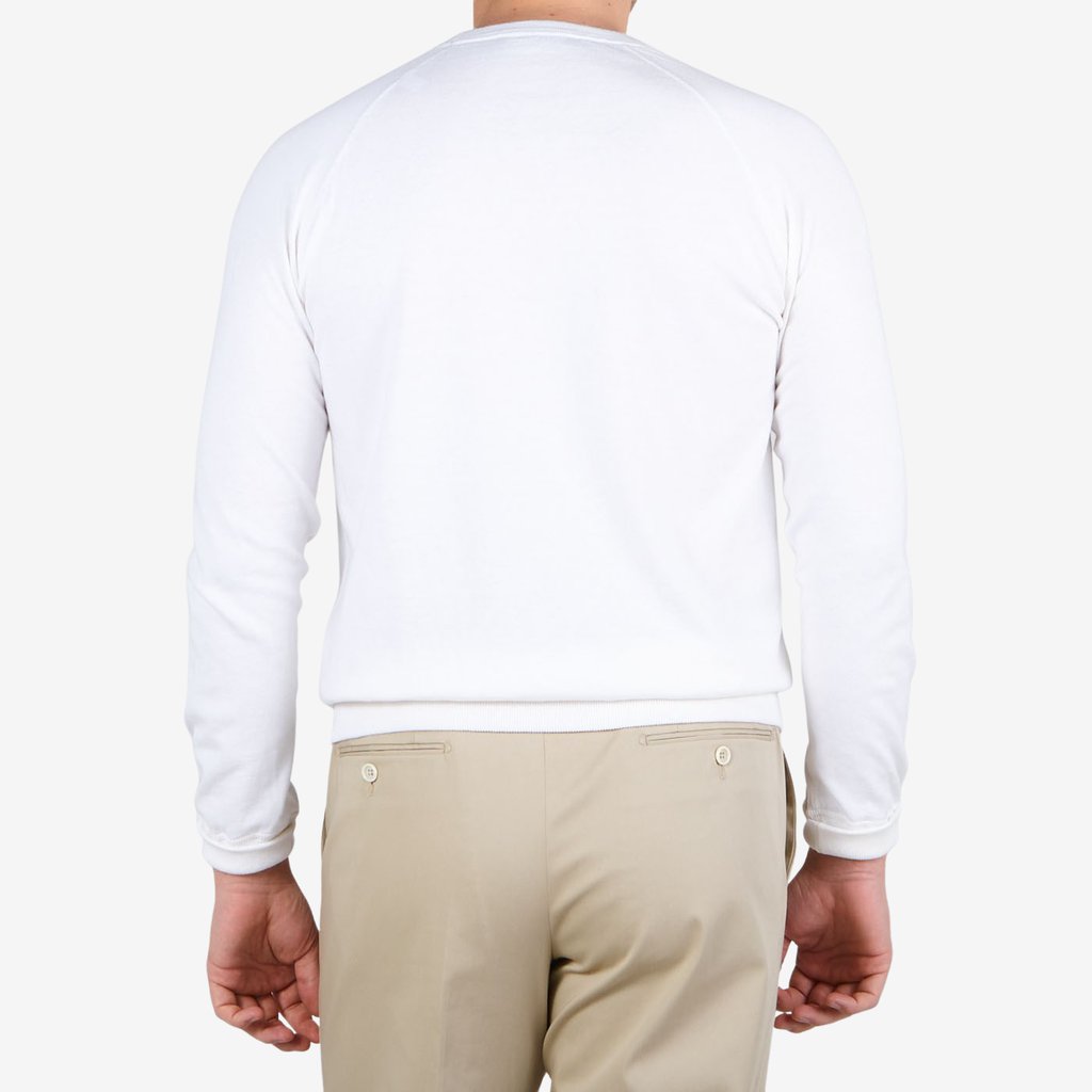 The back view of a man wearing a Gran Sasso Off-White Cotton Cashmere Crew Neck sweater and khaki pants.