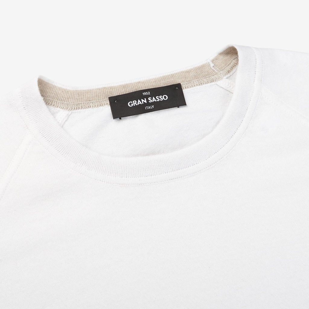 A Gran Sasso off-white cotton cashmere crew neck t-shirt with a label on it.