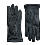 A pair of Hestra Black Cashmere Lined Peccary Handsewn Gloves on a grey surface.