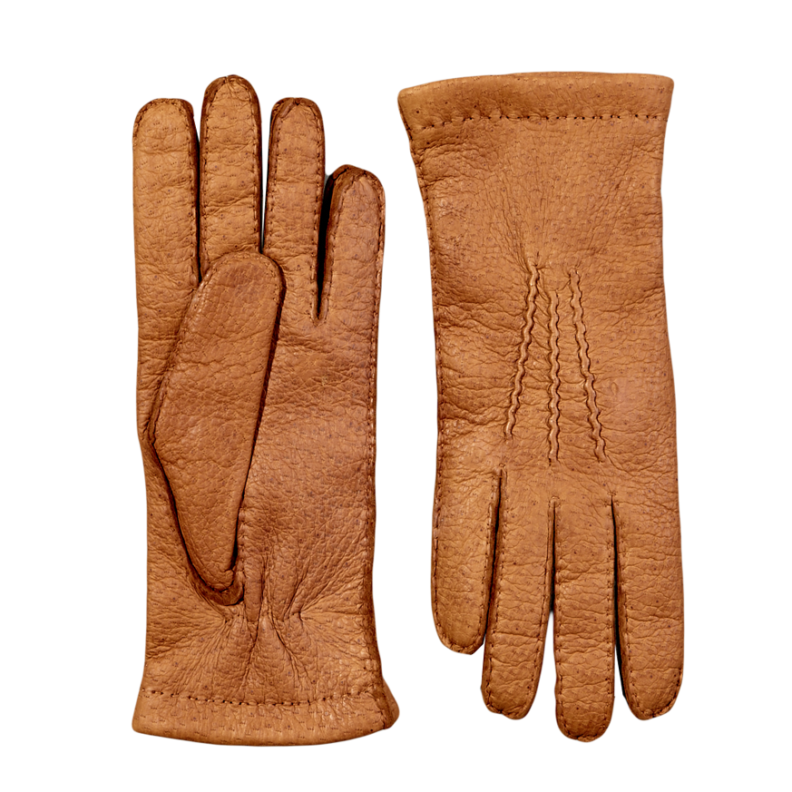 Hestra Cork Peccary Handsewn Cashmere Gloves on a grey surface.