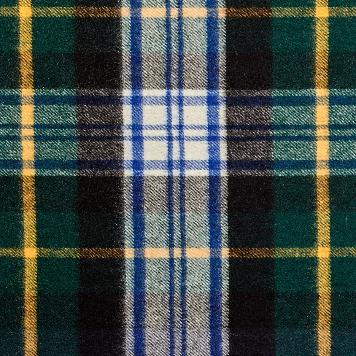 A close up of a Johnstons of Elgin Navy Checked Dress Gordon Cashmere Scarf.