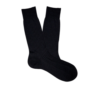 A pair of comfortable Pantherella Black Merino Wool Ribbed Ankle Socks on a white background.