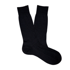 A pair of comfortable Pantherella Black Merino Wool Ribbed Ankle Socks on a white background.