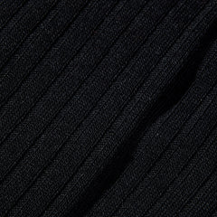 A wardrobe essential, this close up image showcases the comfort of Pantherella's Black Merino Wool Ribbed Knee Socks.