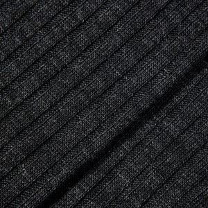 A close up image of a black Charcoal Merino Wool Ribbed Ankle Socks by Pantherella.
