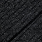 A close up image of a black Charcoal Merino Wool Ribbed Ankle Socks by Pantherella.