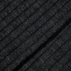 A close up image of a black Charcoal Merino Wool Ribbed Ankle Socks by Pantherella.