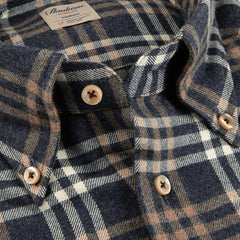 Close-up of the Stenströms Blue Checked Cotton Flannel Slimline Shirt with a brown plaid pattern and white and beige buttons. Made from brushed cotton twill, the shirt includes a visible brand and size tag.