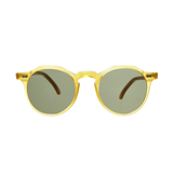 A pair of Lapel Honey Frame sunglasses by The Bespoke Dudes with Bottle Green Lenses on a comfortably fitting green background.