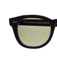 A pair of Donegal Black with Green Lenses 49mm sunglasses by The Bespoke Dudes with the words 'the resource dudes eyes' on them, crafted in Italy.