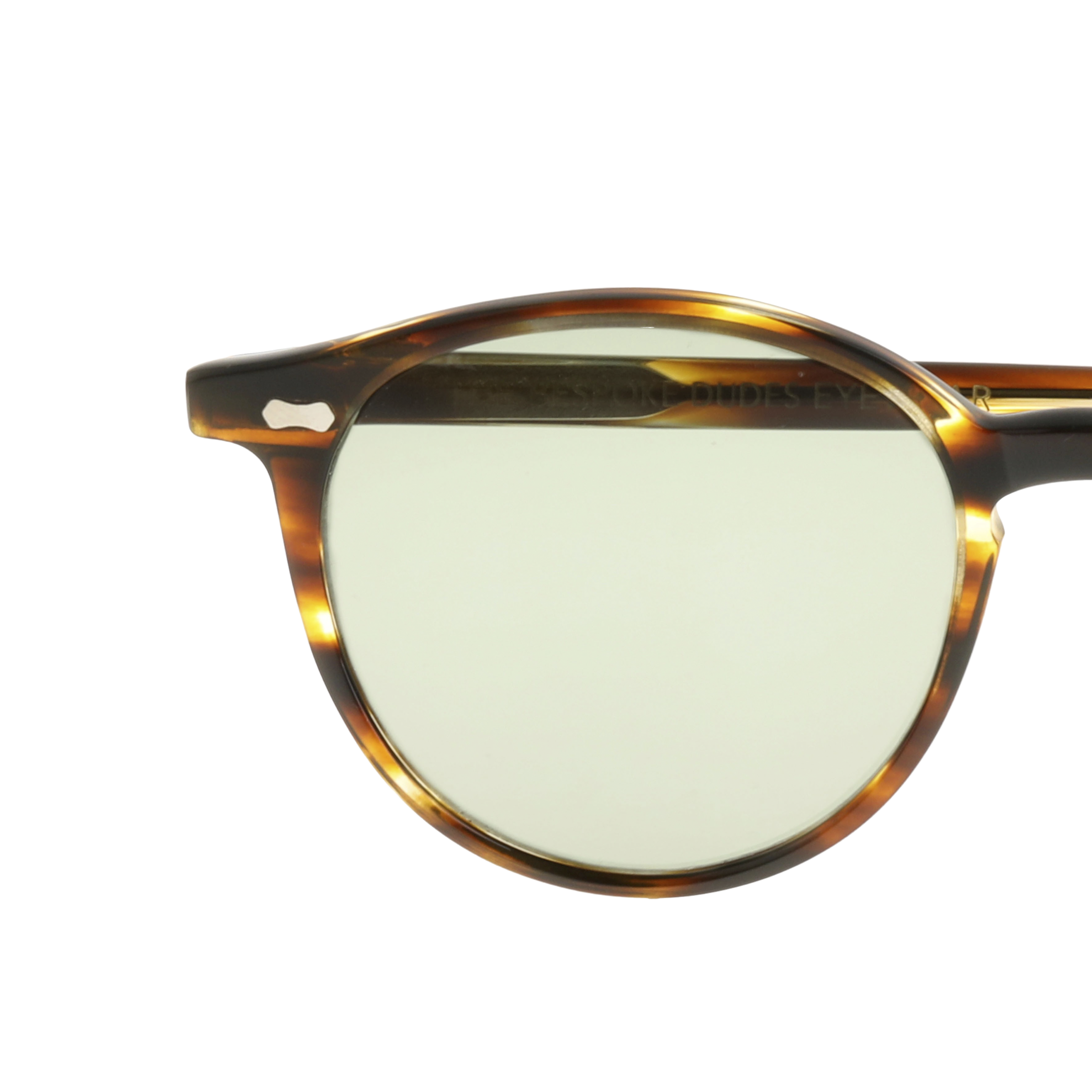 A handmade panto-shaped pair of Cran Light Havana sunglasses by The Bespoke Dudes with a tortoise frame and green lenses.